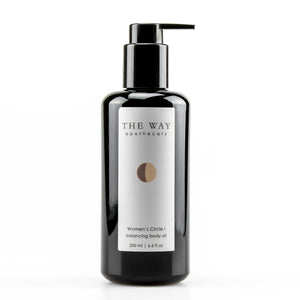 The Way Apothecary Women’s Circle I Balancing Body Oil in a black glass pump bottle, photographed on a white background